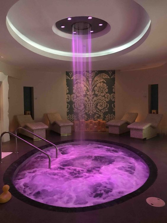 Hospital – spa concept – pink-purple LED-lit waterfall-shower jacuzzi ...